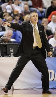 Dayton Coach Brian Gregory directs his offense against West Virginia during the second half on Friday.