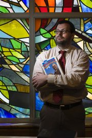 Michael Zogry, assistant professor of religious studies at Kansas University, presents a lecture, “Religion and Basketball: Naismith’s Game,” on Thursday. Zogry recently found a Lucite piece commemorating Phog Allen inside Allen Fieldhouse.