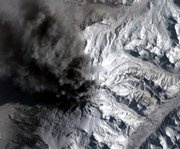 This satellite image provided by GeoEye and taken March 30 shows Alaska’s Mount Redoubt volcano as it emits a steady ash plume. The U.S. Interior Department is spending some of its first stimulus dollars to improve volcano monitoring.