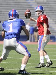 Blue team quarterback Todd Reesing pitches to running back Jake Sharp during the first half of the 2009 Spring Game Saturday, April 11, 2009 at Memorial Stadium.