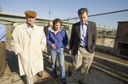 Senator Sam Brownback, right, was in Lawrence on Tuesday getting a first-hand look at renewable energy sources. Stephen Hill, president of Bowersock Mills and Power Co., and Sarah Hill-Nelson showed Brownback the facility.