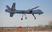 In this photo released March 31 by Homeland Security’s Customs and Border Protection Agency is an unmanned aircraft used to monitor Red River flooding as it lands at Grand Forks, N.D., Air Force Base on Feb. 16.