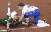 KU third baseman Val Chapple, right, tags out a Baylor runner on a play at third in the bottom of the sixth inning in KU's 7-3 win over Baylor in the first game of a double-header Saturday at KU.