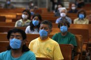 Parishioners at Metropolitan Cathedral attend a closed-door Mass on Sunday in Mexico City. Churches stood empty Sunday in Mexico City after services were canceled, and health workers screened airports and bus stations for people sickened by a new strain of swine flu that experts fear could become a global epidemic.