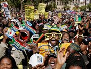 People react after the swearing in ceremony for South African President Jacob Zuma on Saturday in Pretoria, South Africa. Zuma took the presidential oath to become leader of the continent’s economic powerhouse after overcoming corruption and sex scandals and a struggle for control of his party.