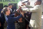 Pastor Andre Assis lays hands on an alleged drug trafficker March 31 at a slum in Rio de Janeiro. Evangelical preachers are trying to do through God what police have yet to do through guns: bring peace across the vast shantytowns that house about 30 percent of Rio’s 6 million people, thousands of whom die in gang wars each year.