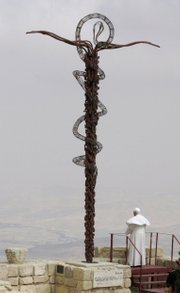 Pope Benedict XVI prays close to the Antique Basilica and Moses Memorial on Monte Nebo where the Bible says Moses saw the Promised Land, Saturday in Amadaba City, Jordan. The pope’s visit to Mount Nebo was the first of many that Benedict will make to holy places during his first visit to the Middle East.