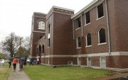 Members of Girard United Methodist Church visit the old church building one last time on April 19 for a short ceremony. The building will soon be demolished because of structural damage caused by an ice storm in 2006.