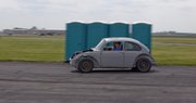 KU engineering students drive their hybrid car, made using a 1974 Volkswagen Super Beetle, which starts on biodiesel, then runs on an electric motor. They hope the vehicle gets 500 miles per gallon one day.