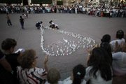 Supporters of Zitacuaro Mayor Antonio Ixtlahuac, also known as Tono, who was taken into custody by federal agents, light candles Wednesday to demand his release at the town’s main square in Mexico’s Michoacan state. Ixtlahuac’s arrest was part of a drug sting.