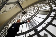 Catherine Moss, who says she had climbed the height of Everest three times over in just one year as a Big Ben guide, talks April 30 during a pre-anniversary tour, inside the St. Stephens tower of the Houses of Parliament, housing the Big Ben bell, in central London. Big Ben is having its 150th birthday Sunday, its Victorian chimes carrying the sound of Britain into the 21st century. The 314-foot-high tower, roughly 16 stories, is the city’s most famous landmark.