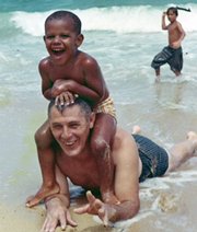 This photo, provided by the presidential campaign of Sen. Barack Obama, D-Ill., shows WWII veteran Stanley Armour Dunham playing with his grandson Barack Obama.