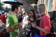 Hanging out on the Free State Brewing Co. porch are, from left, Patrick Stallbaumer, Joy Friedman and Julie Shrack in this 2009 file photo. Happy hour was reinstated in Kansas on July 1, 2012.