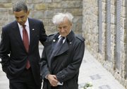 President Barack Obama and Buchenwald survivor Elie Wiesel visit the memorial site for the “Kleines Lager” (Little Camp) on Friday inside the Buchenwald concentration camp near Weimar, Germany.