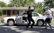 Brryan Jackson, left, dances in the street with his friend Kendra Sontag as music blasts out of her car radio Thursday in St. Charles, Mo. As a baby, Jackson’s father secretly injected him with a syringe of HIV-tainted blood in hopes of killing the child, but the now-18-year-old is graduating from high school today and is stepping up his public speaking about fighting the stigma of AIDS and the power of faith and forgiveness.