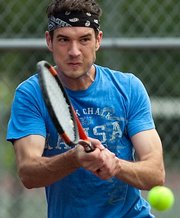 Aaron Douglas returns a shot in the finals of the men’s 4.0 Singles division of the Lawrence Open. Douglas won that title Sunday at Lawrence Tennis Center.