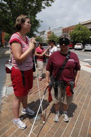 Students from Missouri State University try to navigate the streets of Lawrence blindfolded as part of a certification program for teachers of the visually impaired and orientation and mobility specialists.
