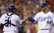 Kansas City Royals starting pitcher Luke Hochevar (44) is congratulated by catcher Miguel Olivo after pitching a complete game against the Cincinnati Reds. The Royals won, 4-1, Friday in Kansas City, Mo.