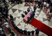 U.S. honor guards carry the coffin of Sgt. Jasper Obakrairur, 26, of Palau, during a funeral ceremony Tuesday at the Palau Capital building in Melekeok. Obakrairur is the first Palauan to be killed in Afghanistan under Operation Enduring Freedom.