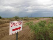 A sign points to the site of New Mexico’s planned spaceport near Upham, N.M., in this May 21 photo. A groundbreaking ceremony is planned for Friday to mark the start of construction on a terminal and hangar facility and 10,000-foot runway.