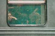 A subway rider looks through a window during heavy rainfall Thursday in Brooklyn, New York City. Forecasters at the National Weather Service warned that up to 2 inches of rain could fall Thursday.