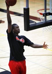 Ames High School basketball player Harrison Barnes shoots during practice at the school in Ames, Iowa. The 6-foot-7 standout has been pegged by many as the top prospect in the country.