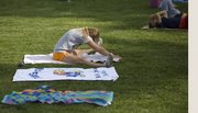 Chris Barritt, Lawrence, stretches in the field beside Robinson Gymnasium ahead of a Red Dog’s Dog Days workout. There is evidence to suggest that stretching before exercising may be counterproductive.