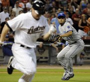 Joakim Soria (48) throws to first base for the final out against Houston’s Jason Michaels. The Royals won, 2-1, on Tuesday in Houston.