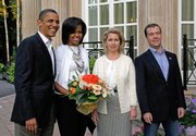 President Barack Obama, first lady Michelle Obama, Svetlana Medvedev and her husband, Russian President Dmitry Medvedev, pose Monday at the Gorki residence outside Moscow. The leaders pledged to reduce nuclear stockpiles by about a third on Monday.