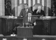 President John F. Kennedy speaks in the House of Representatives before a joint session of Congress in Washington in this May 25, 1961, file photo. In the background are Vice President Lyndon B. Johnson, left, and House Speaker Sam Rayburn. During the address, Kennedy issued the challenge, “I believe that this nation should commit itself to achieving the goal, before this decade is out, of landing a man on the Moon and returning him safely to the Earth.” The 40th anniversary of the Apollo 11 launch, which took U.S. astronauts to the moon, is Thursday.