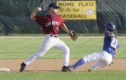 Lawrence Raiders second baseman Austin Holladay gets a force out at second and throws to first during the first game of a doubleheader against Emporia on Tuesday.