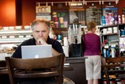 Lawrence engineer David File works at Dunn Bros. Coffee, 1618 W. 23rd St. File says he likes to work at the coffee shop because too many distractions exist at home, and the coffee shop provides an environment where he feels more productive.
