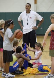 Former KU basketball player Wayne Simien works with girls in his Called to Greatness basketball camp Wednesday at Free State High school.