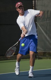 Michael Swank of Lawrence returns the ball in a tie-breaker match Friday in the KU ITA summer circuit tournament at First Serve.