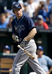 Tampa Bay’s Gabe Gross tosses his bat as he walks with the bases loaded in the eighth inning. The Rays beat the Royals, 4-3, Sunday in Kansas City, Mo.