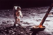 Astronaut Edwin “Buzz” Aldrin walks by the footpad of the Apollo 11 lunar module in this July 1969 file photo.