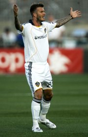 Los Angeles Galaxy midfielder David Beckham asks for a call from the officials during an MLS soccer game against the Kansas City Wizards. The teams played to a 1-all draw Saturday in Kansas City, Kan.
