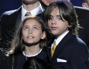 Paris Jackson, left, and Prince Michael Jackson I stand together on stage during the memorial service for their father, Michael Jackson, at the Staples Center in Los Angeles. A custody agreement for Michael Jackson’s three children has been made between Jackson’s mother, Katherine Jackson, and Deborah Rowe, the mother of the singer’s two oldest children, but financial issues remain to be ironed out.