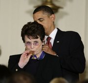 President Barack Obama presents the 2009 Presidential Medal of Freedom to Billie Jean King, known for winning the “Battle of the Sexes” tennis match and championing gender equality issues, during ceremonies Wednesday at the White House in Washington.