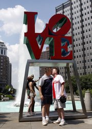 Frank Echols, right, and Bob Robinson kiss at Love Park in Philadelphia on Saturday during a kiss-in organized by gay rights activists. On Saturday activists gathered in more than 50 cities in the U.S. and Canada for the Nationwide Kiss-In, a mass demonstration of public affection.