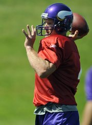 New Minnesota Vikings quarterback Brett Favre tosses a pass during practice Tuesday in Eden Prairie, Minn.