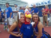 Miles McEachen takes a photo with KU cheerleaders at Fan Appreciation Day Wednesday, August 26, 2009.