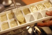 Finally, spoon the processed baby food into ice cube trays to be frozen and later thawed when desired.