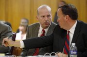 Scott Roeder speaks with his attorney Mark Rudy in this July 28 file photo during Roeder’s preliminary hearing in court in Wichita. Roeder, 51, is charged in the death of Dr. George Tiller but has pleaded not guilty.