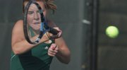 Free State’s MacKenzie Lown returns against Olathe South. Despite a head cold, Lown won her match, and the FIrebirds beat Olathe South, 4-0.