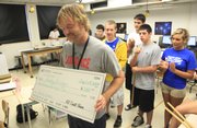 Lawrence High physics teacher Andy Bricker received the Lawrence school district’s Horizon Award on Thursday. The award honors outstanding novice teachers.