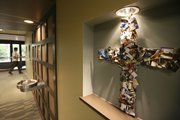 A cross made of credit cards that radio listeners and television viewers have sent Dave Ramsey is displayed in Ramsey’s Lampo Group headquarters in Brentwood, Tenn.