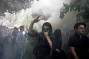 An Iranian female opposition supporter reacts as she attends a protest Friday in Tehran, Iran, in competition with government-sponsored mass rallies to mark an annual anti-Israel commemoration, the Quds Day that reflects the Persian nation’s sympathy with the Palestinians.