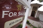 A home is for sale Thursday in Palo Alto, Calif. Home resales dipped unexpectedly last month after a four-month streak of gains, providing evidence that the housing market recovery remains fragile.