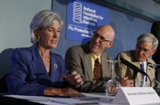Kathleen Sebelius, secretary of Health and Human Services, from left, talks with Mayo Clinic Vaccine Research Group Director Dr. Gregory A. Poland and American Academy of Pediatrics President Dr. David T. Tayloe at the National Press Club in Washington in this Sept. 10 file photo. An unprecedented system to track possible side effects from swine flu vaccinations will begin next month.